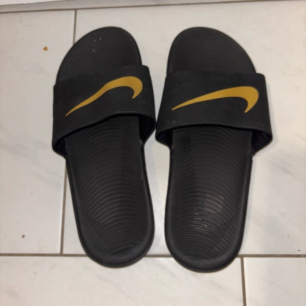 Nike Kids Black Slides with Gold Swoosh